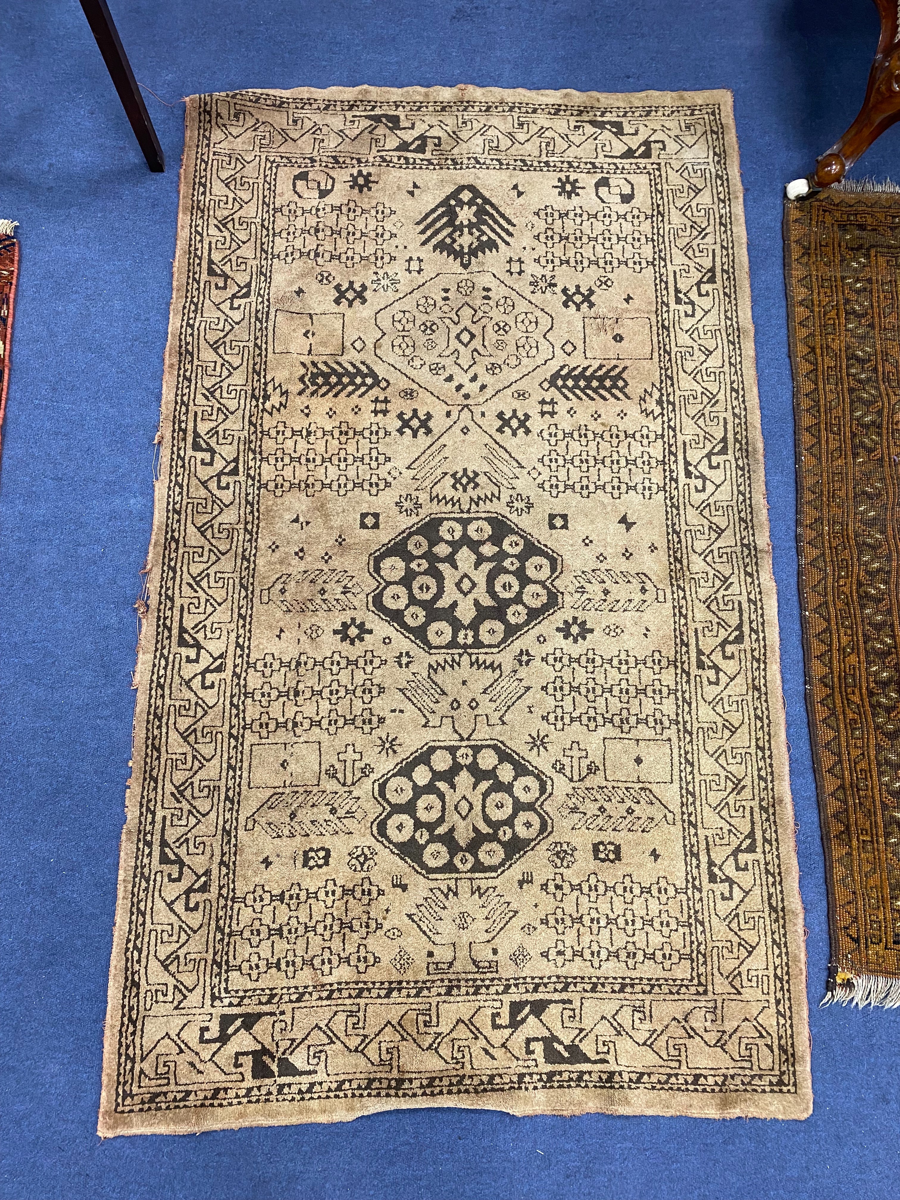 A Bokhara design mustard ground rug, 120 x 103cm together with another rug